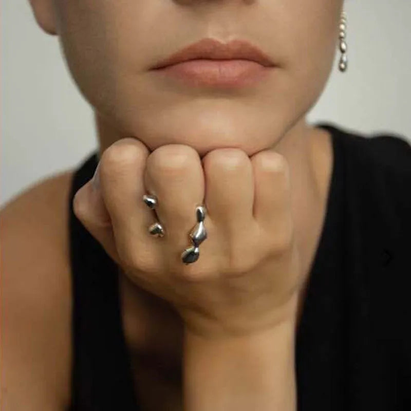 Adjustable brass opening ring with circular sphere element in gold or silver finish