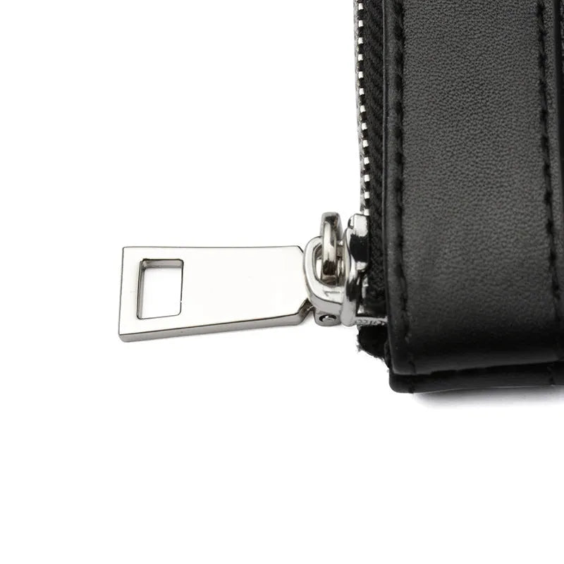 Black leather plaid clutch wallet showing first layer cowhide texture and polyester lining