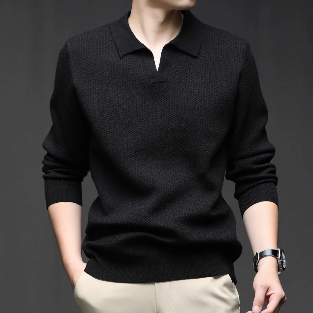 Men's loose green pullover sweater on a hanger, casual autumn wear.