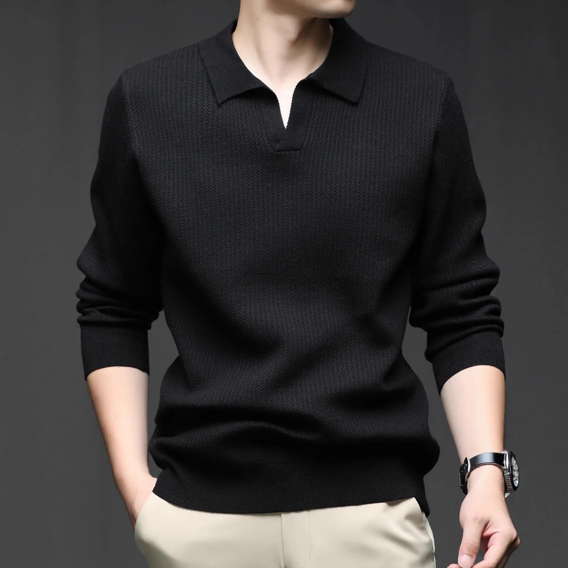 Men's loose green pullover sweater on a hanger, casual autumn wear.
