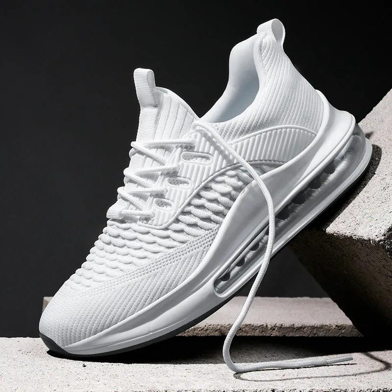 Men's black low-top running shoes with mesh upper and white rubber sole on a plain background.