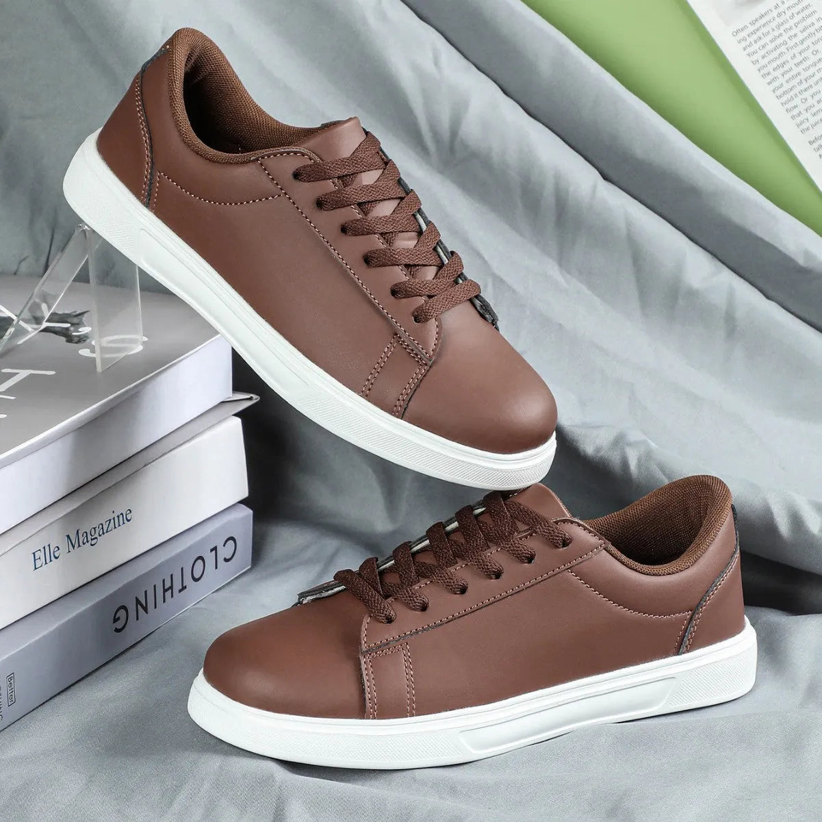 Women's beige brown platform skate sneakers with cross-strap detail and chunky rubber sole.