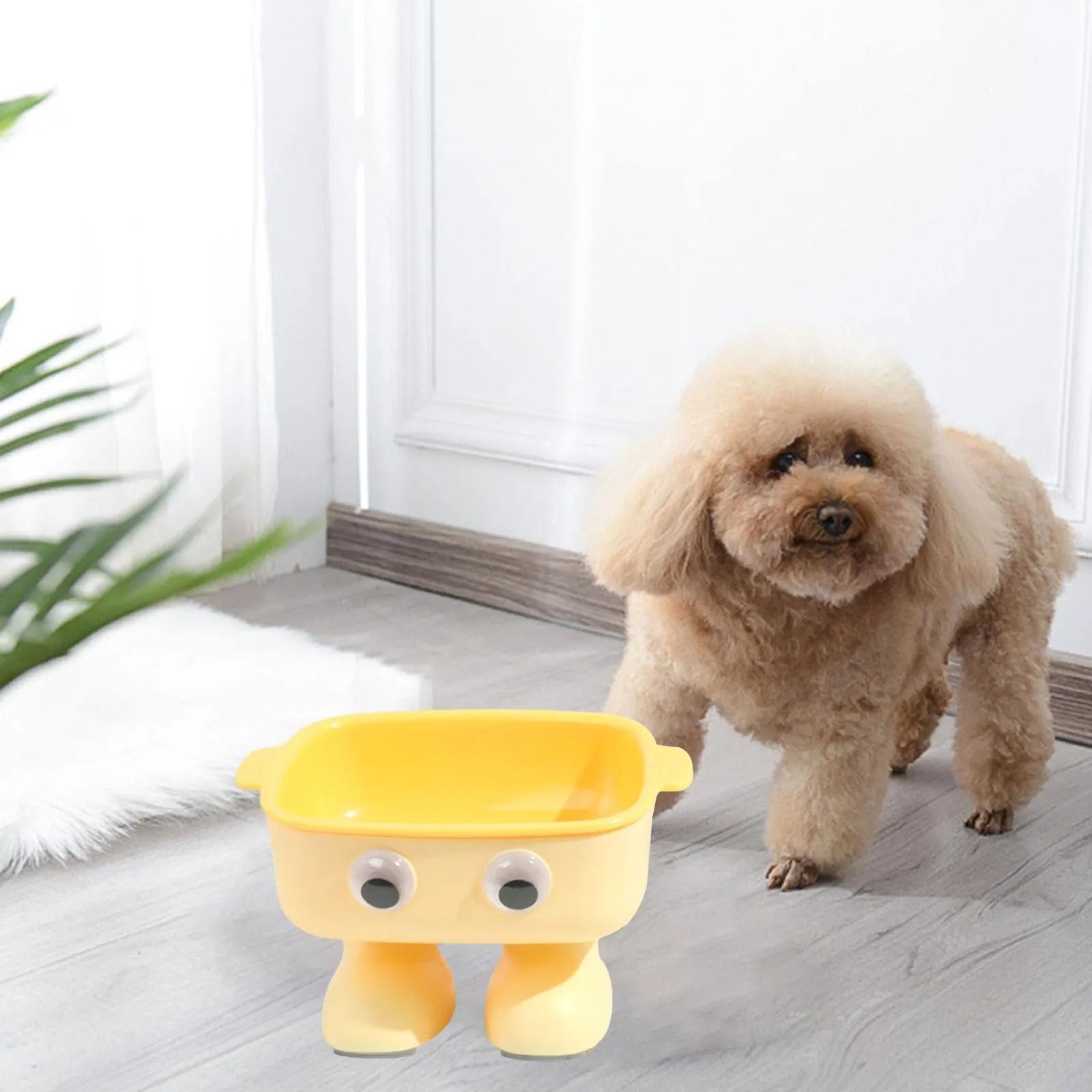 Green robot-shaped elevated cat bowl with tilted design and detachable inner dish