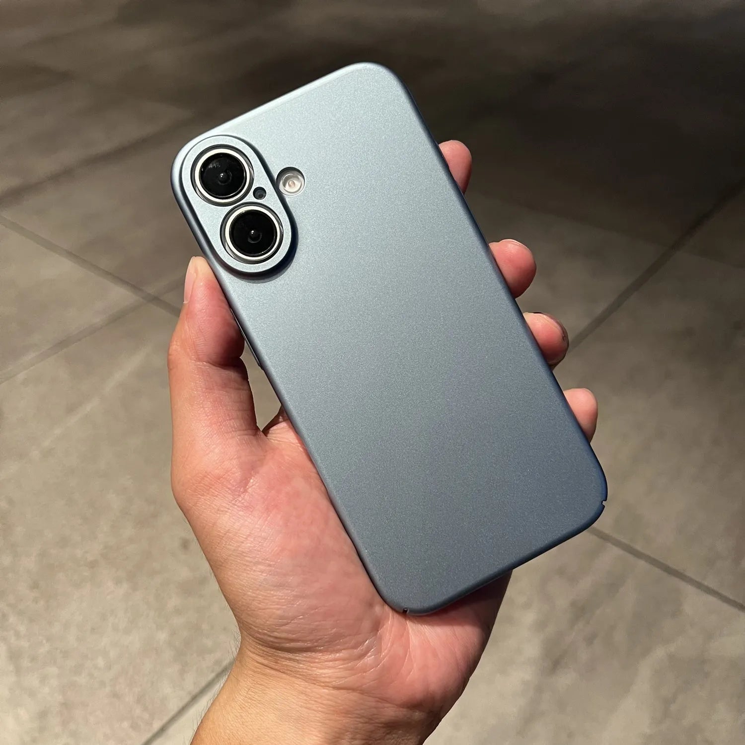 Ultra thin frosted plastic phone case for iPhone 15 Pro Max in black showing camera cutout