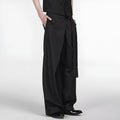 Black straight-leg trousers with a single front pleat and adjustable waistband, laid flat.