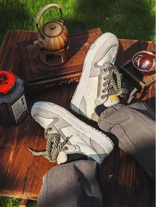 Green low-top casual sneakers with star pattern design on multi-material upper and rubber sole