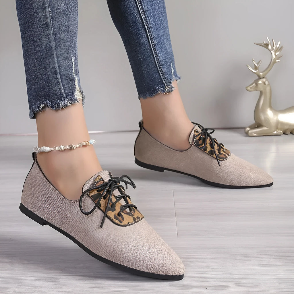 Beige leopard print pointed toe pumps for women with a block heel, shown in a plus size.