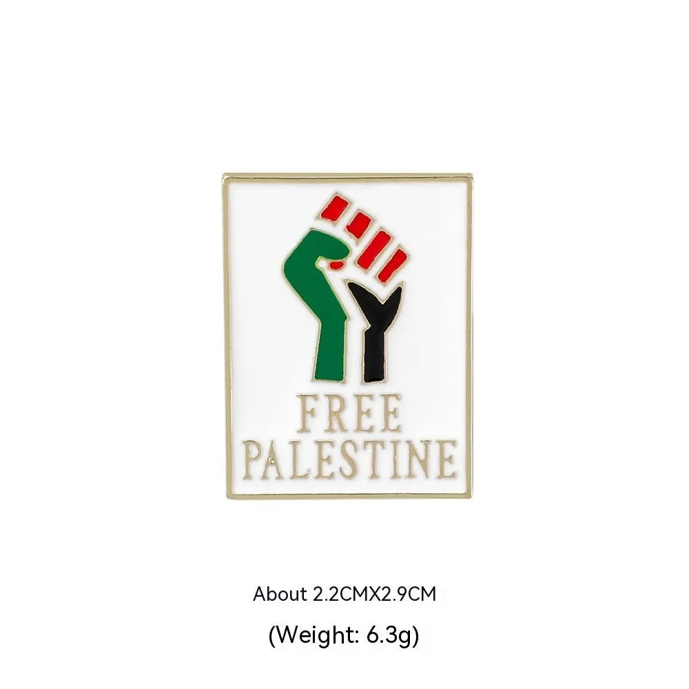 Square corrugated alloy brooch with Palestinian flag design on a neutral background