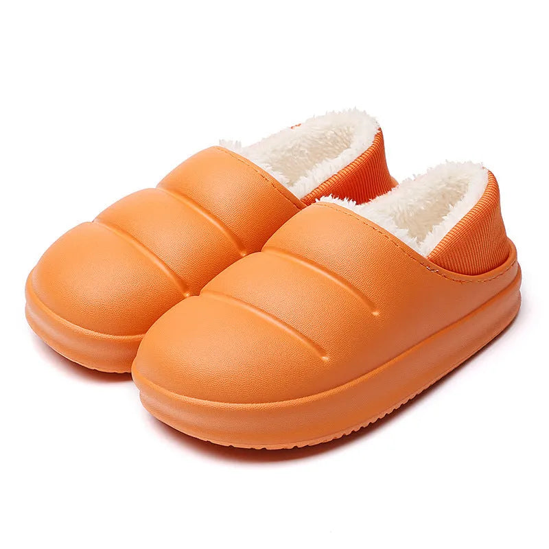 Green EVA waterproof garden slippers with non-slip sole and plush lining shown on wooden decking
