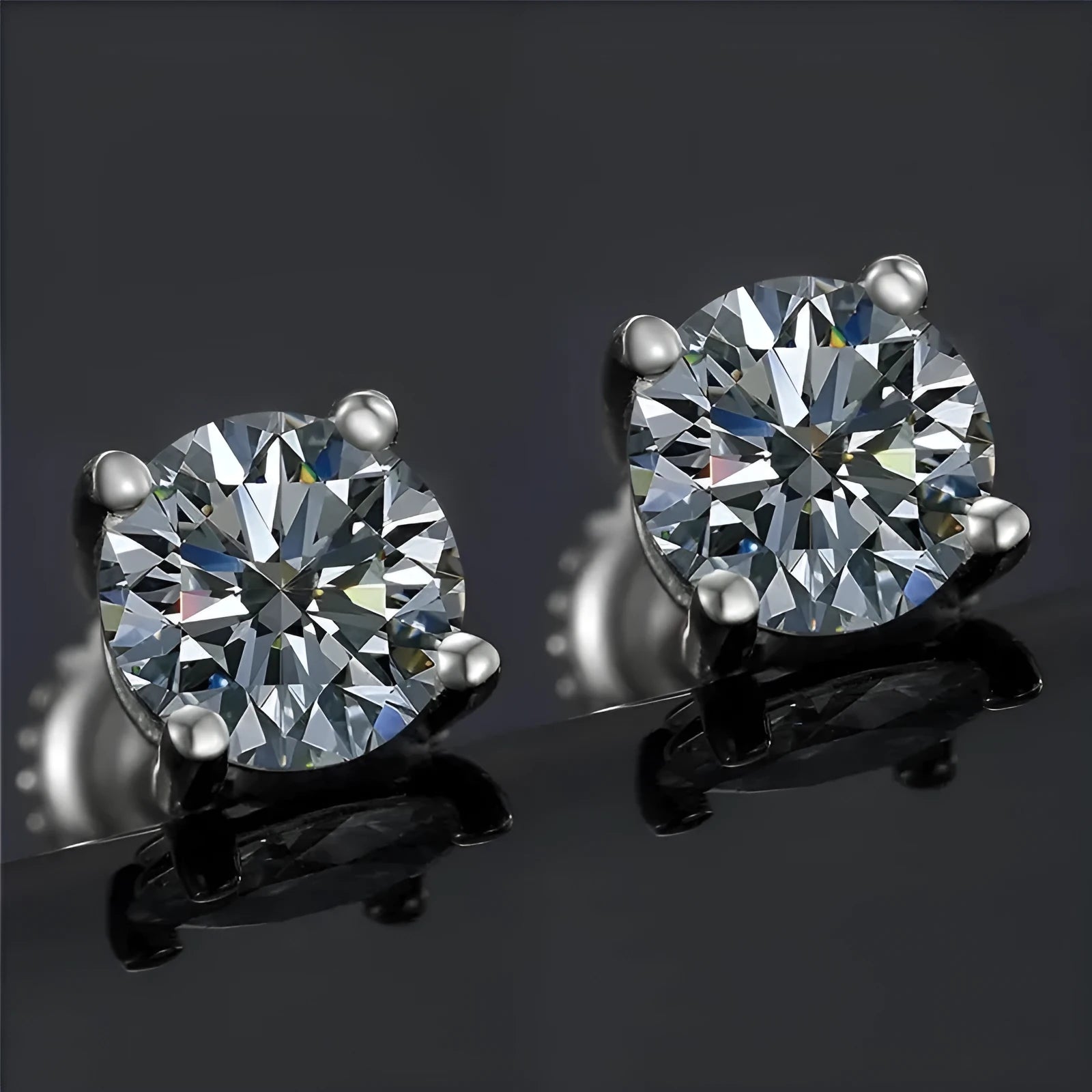 Silver four-claw screw-back stud earrings with a geometric moissanite stone.