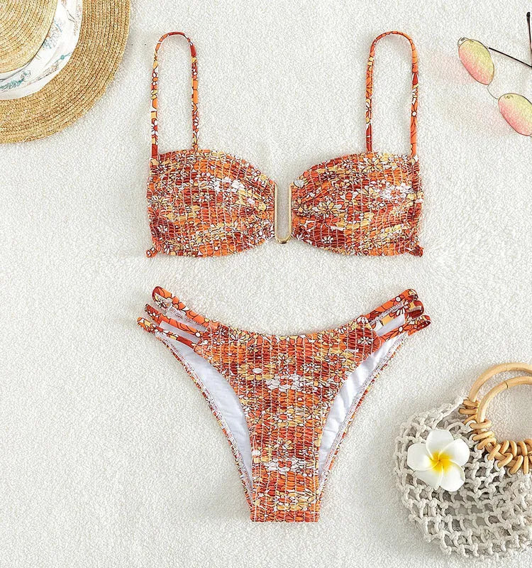 Women's floral print bikini swimsuit with high-waisted briefs in orange, blue, and rose red colours