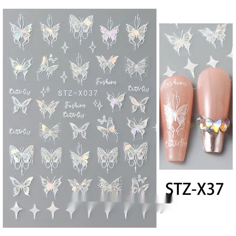 Close-up of a cartoon-style nail sticker with black and silver strips and a love pattern design on a fingernail.