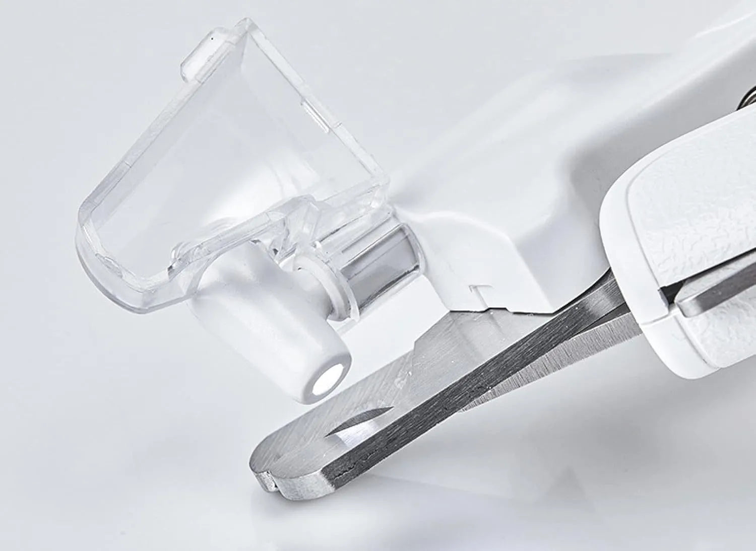 White pet nail clippers with LED light, transparent splash guard, and anti-slip handle.