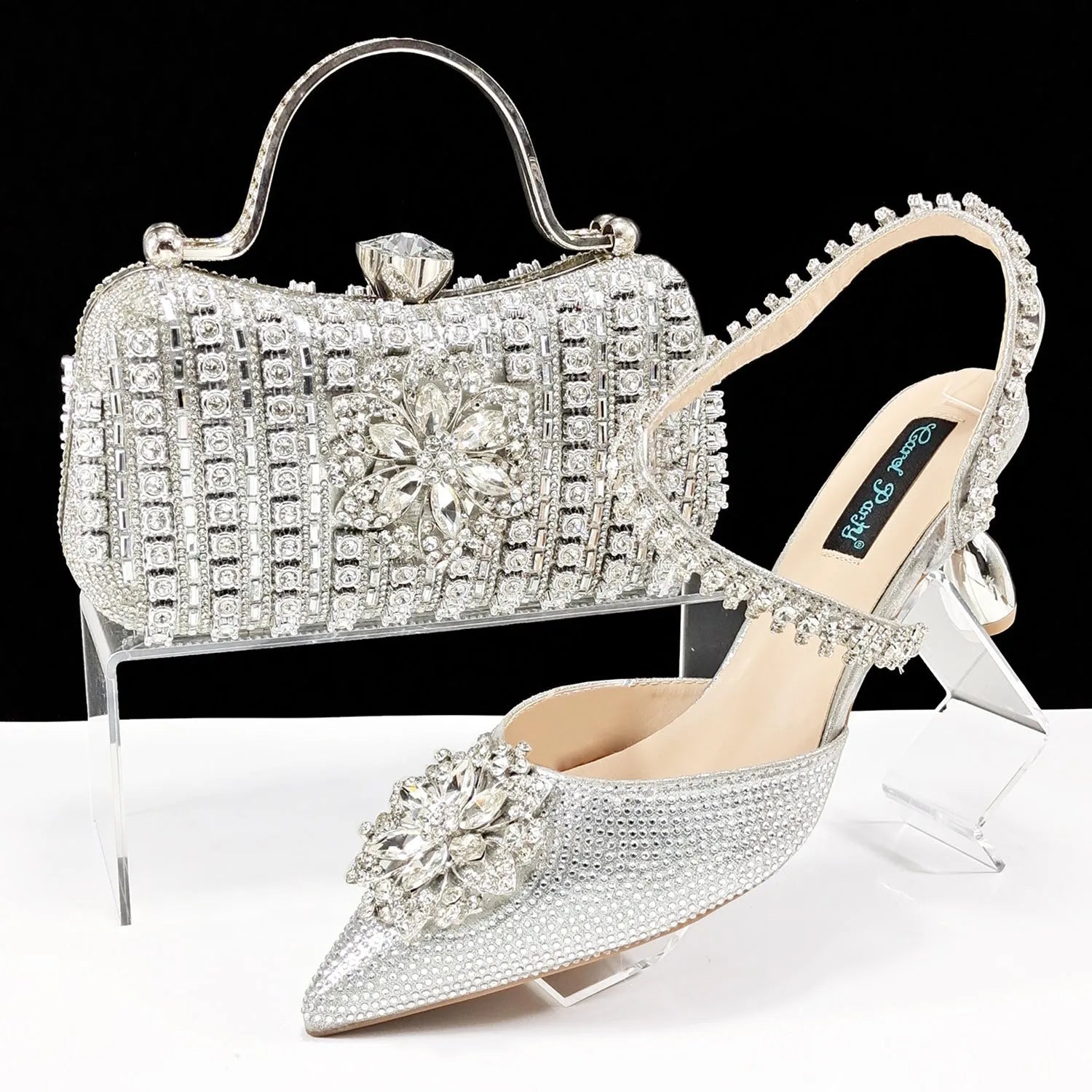 Women's black high heel shoes with matching clutch bag, decorative drill buckle flower ankle chain, and rhinestone details.