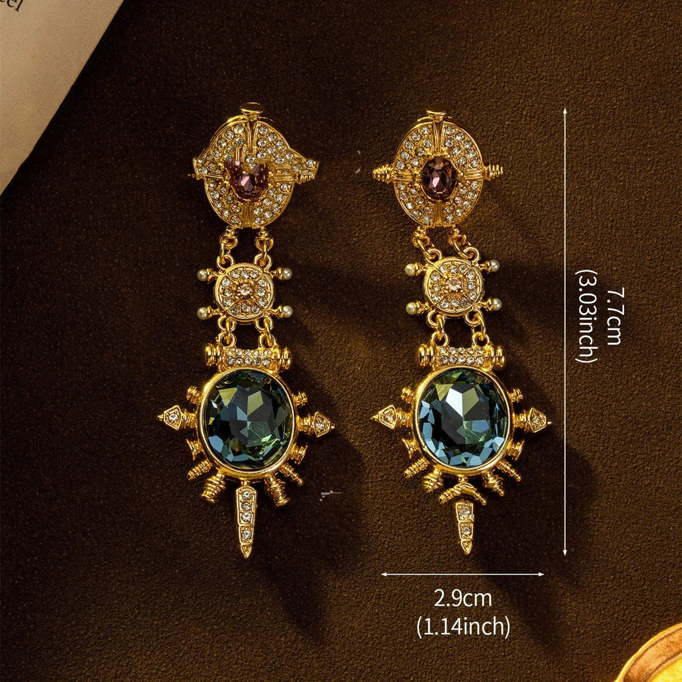 A pair of gold colour geometric round stud earrings with a retro court style design.