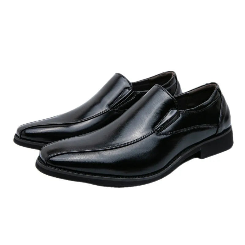 Men's black pointed casual shoes with a patent leather look and flat rubber sole.