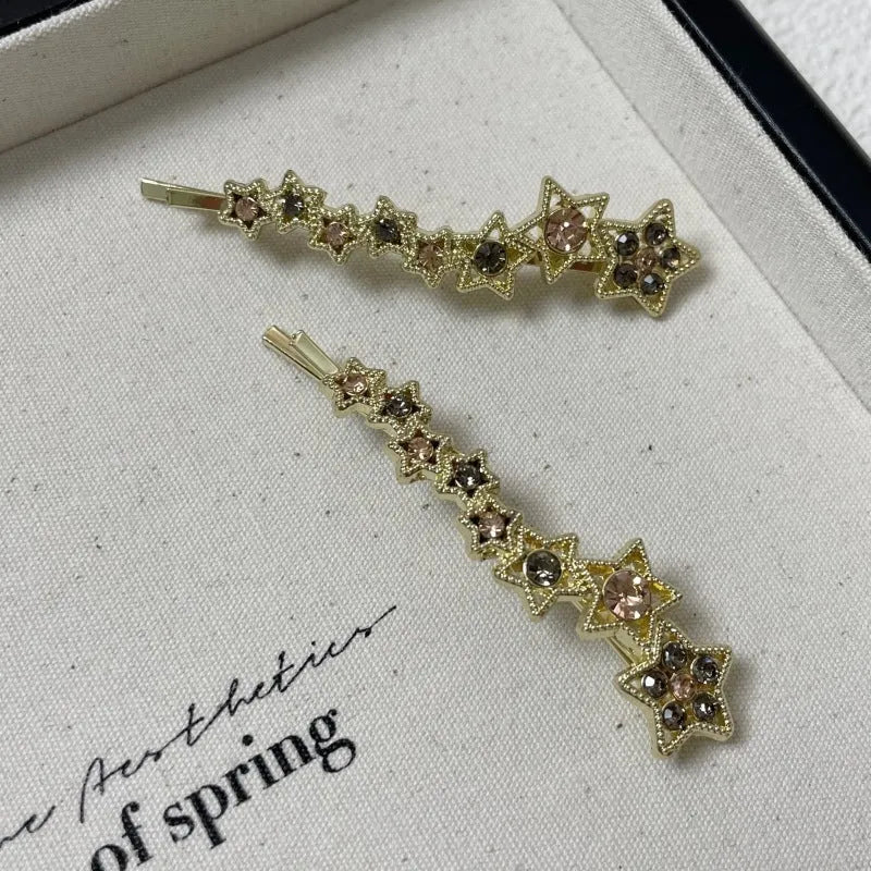 Gold-coloured Korean style hair clip barrette with side clip design and five-pointed star decoration
