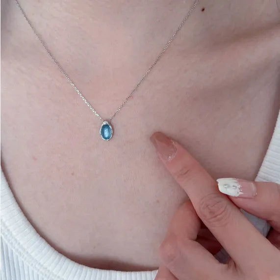 Women's navy blue water drop pendant necklace on adjustable copper cross chain