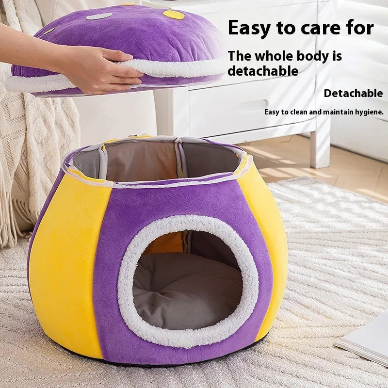 Purple mushroom-shaped plush cat bed for small pets on a grey background.