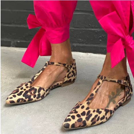 Leopard print women's pumps with cross shoulder straps and a chunky low heel