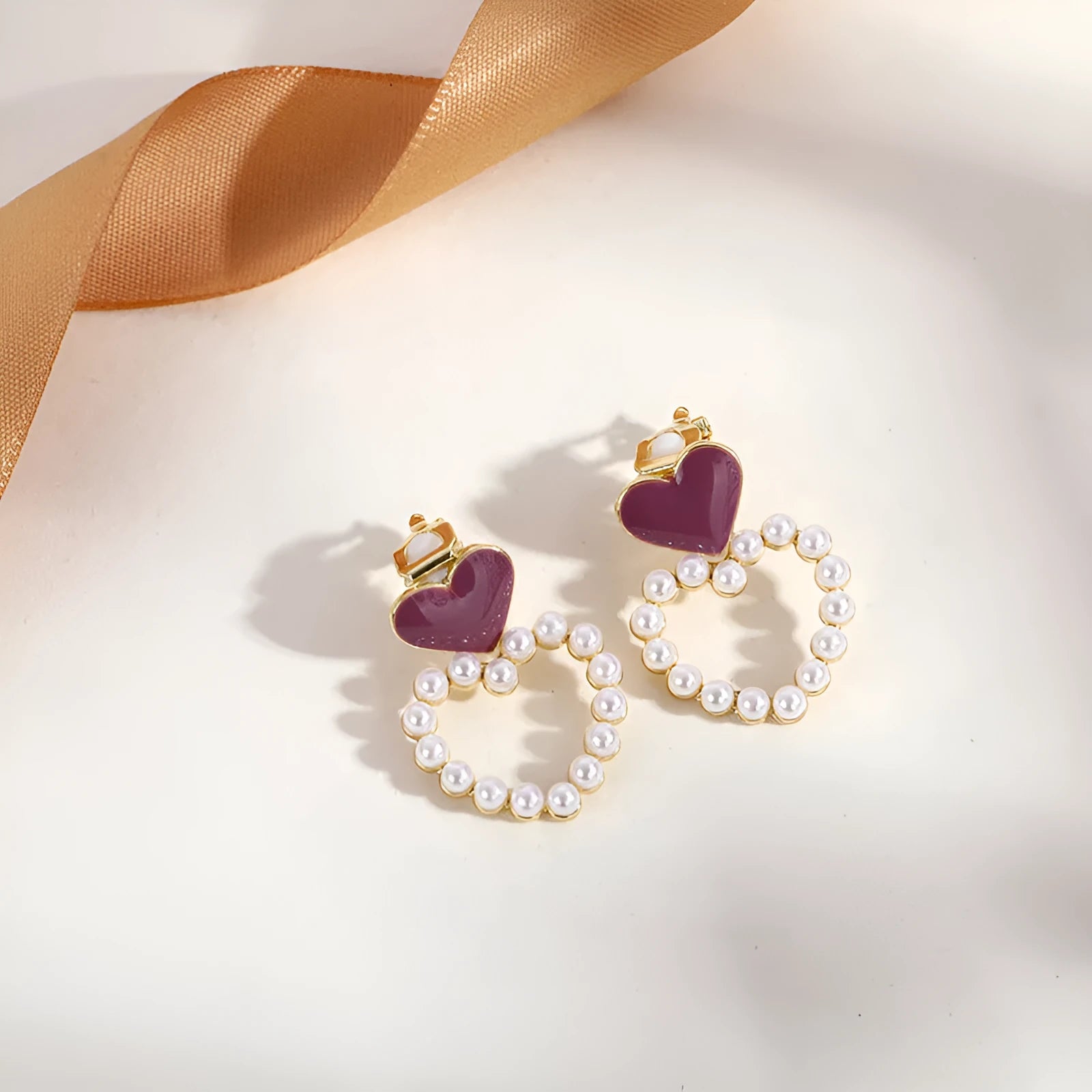 Geometric tassel clip-on earrings in brass and steel, colour G0053.