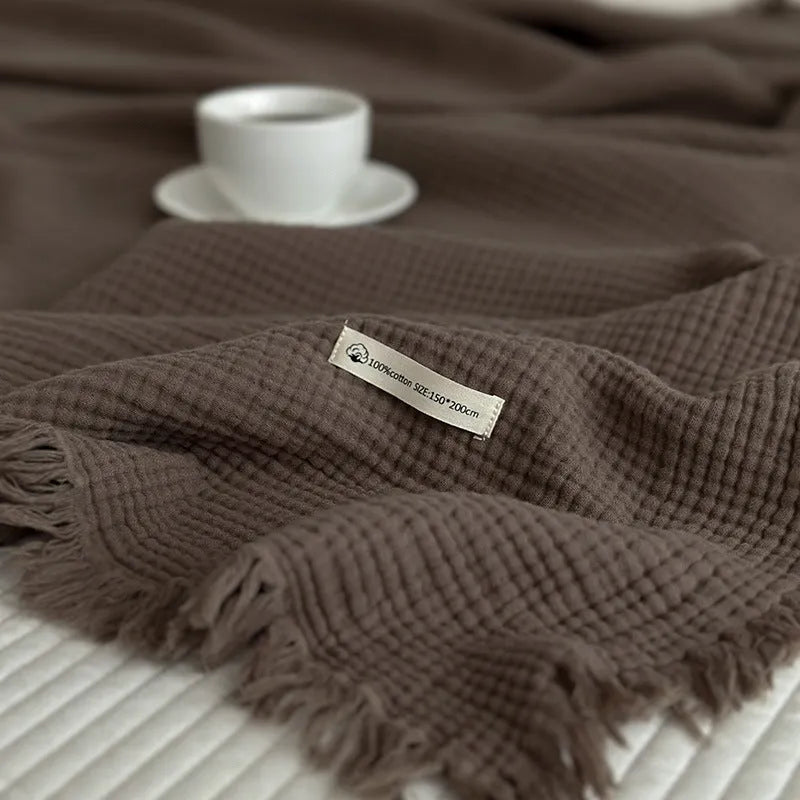 Four-layer gauze cotton blanket with tassel trim in navy blue colour