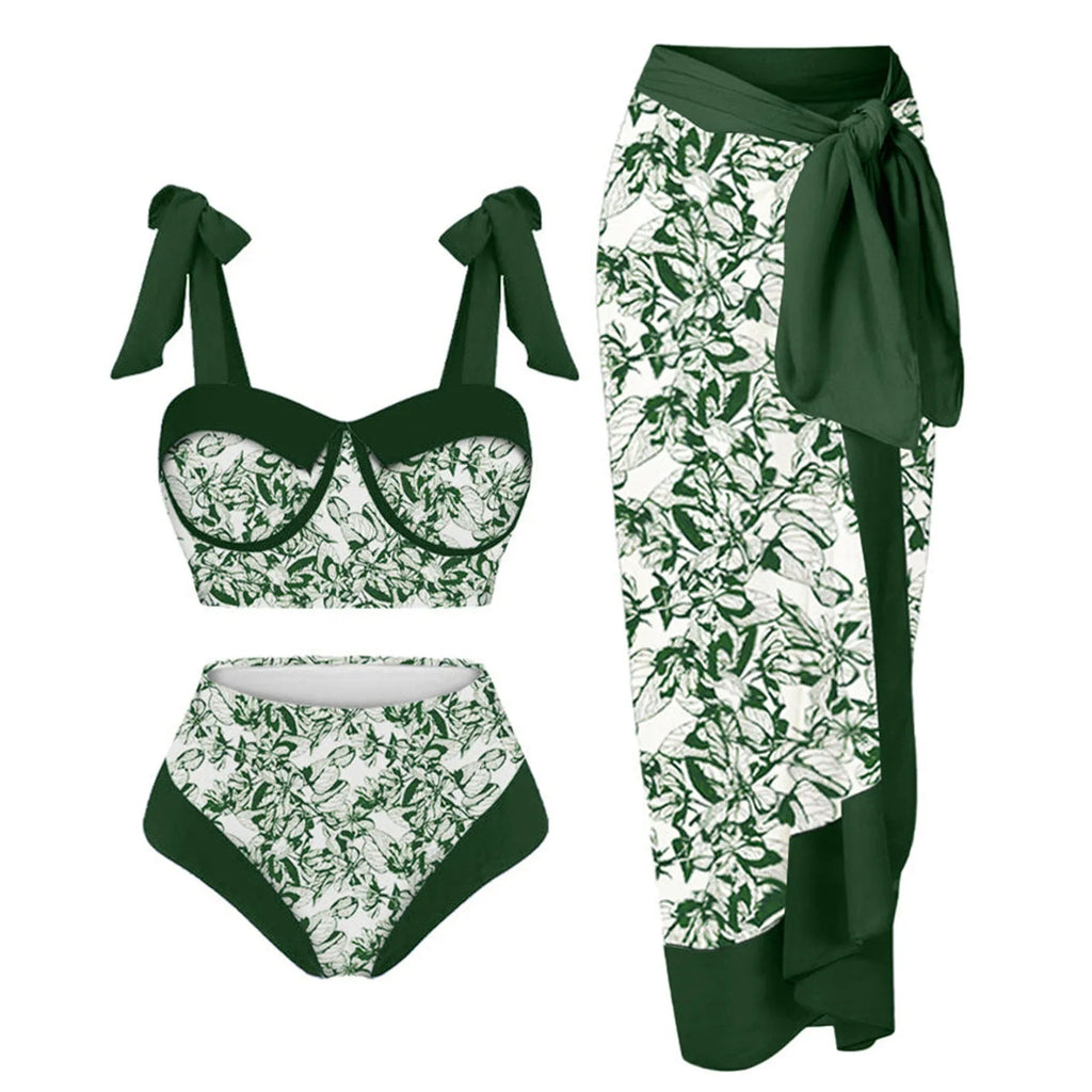 Women's pink printing split swimsuit three-piece set with skirt, bra, and panties on a mannequin.