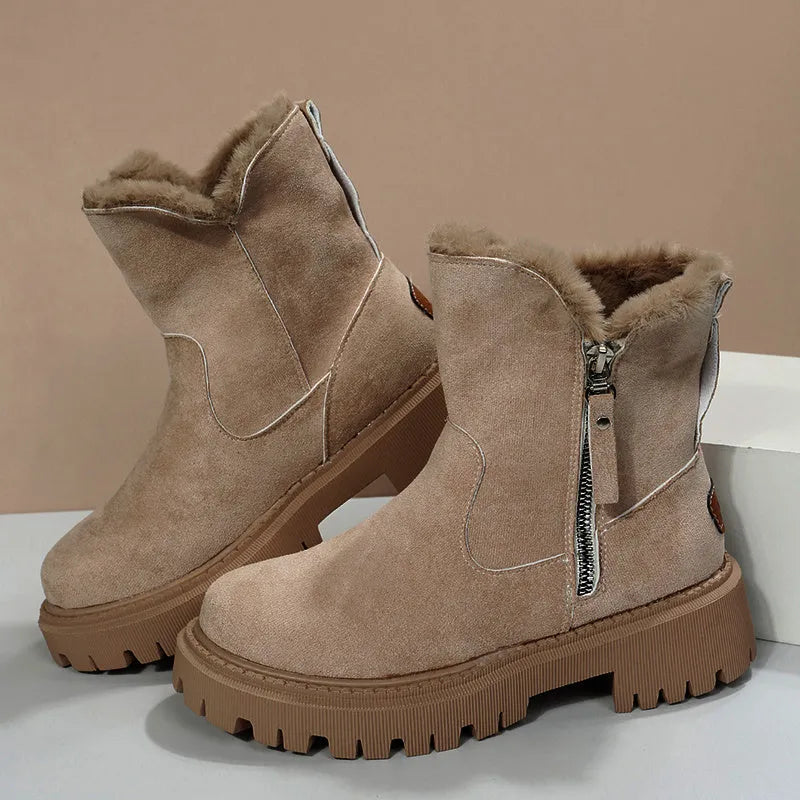 Women's black high-top snow boots with side zipper and thick plush lining on a winter background.