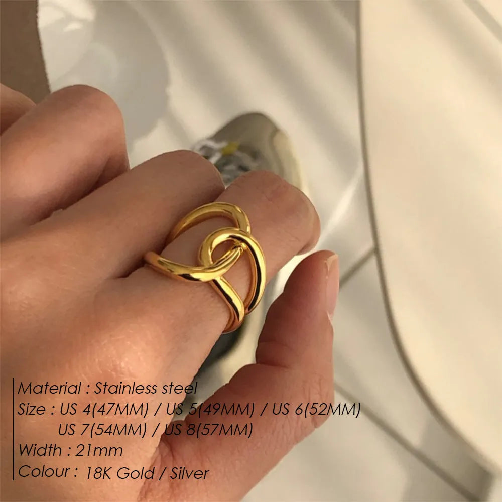 A geometric knotted adjustable ring for women in stainless steel, shown in gold and steel colour finishes.