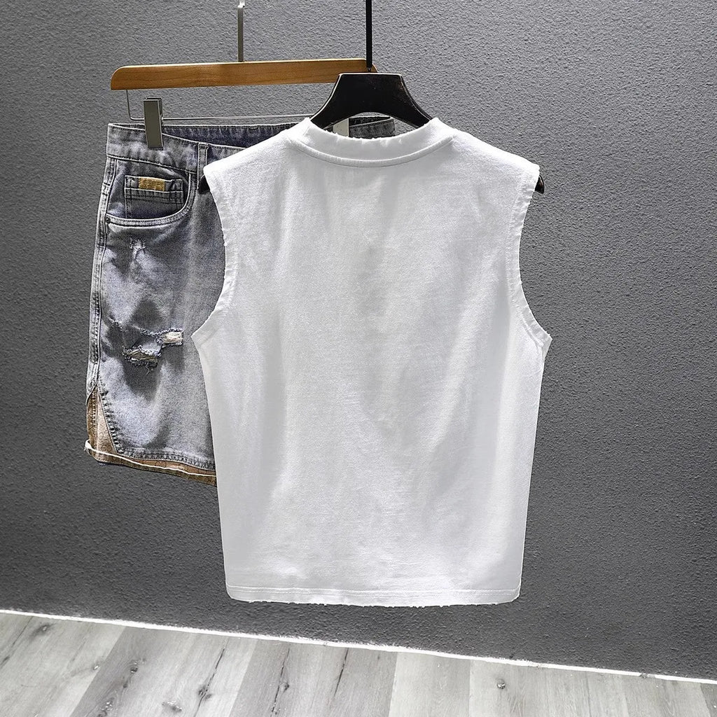 Women's loose-fit black cotton sleeveless t-shirt with straight hem on a hanger.