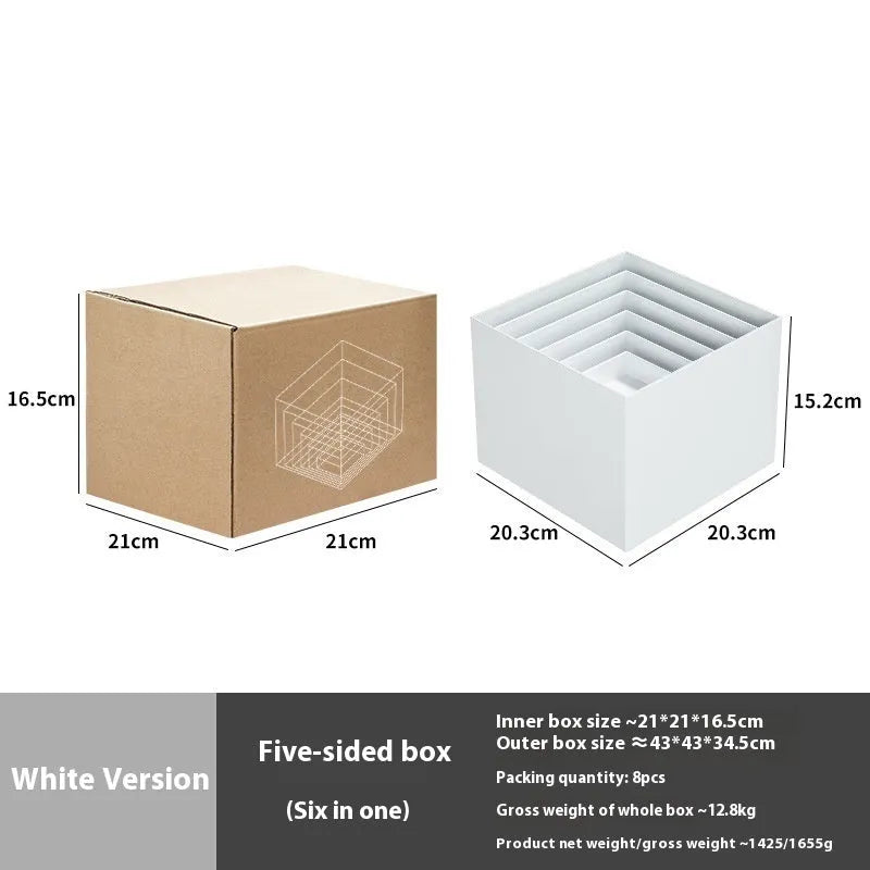 White plastic modular dessert display stand with six interlocking cubes for cake and pastry presentation