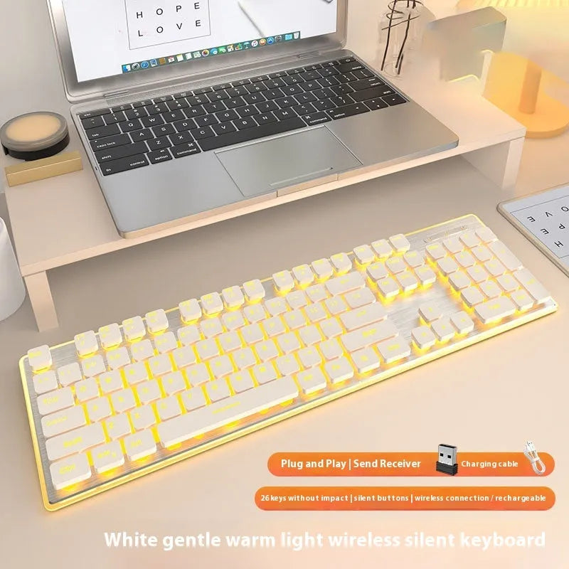 Wireless mute Bluetooth keyboard with ice blue backlighting on desk