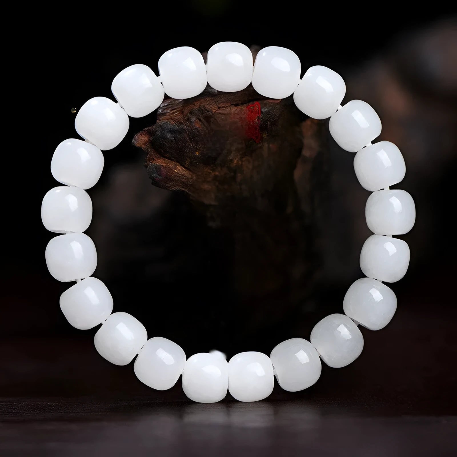 White Hetian jade barrel bead bracelet laid flat, showing unisex casual design.