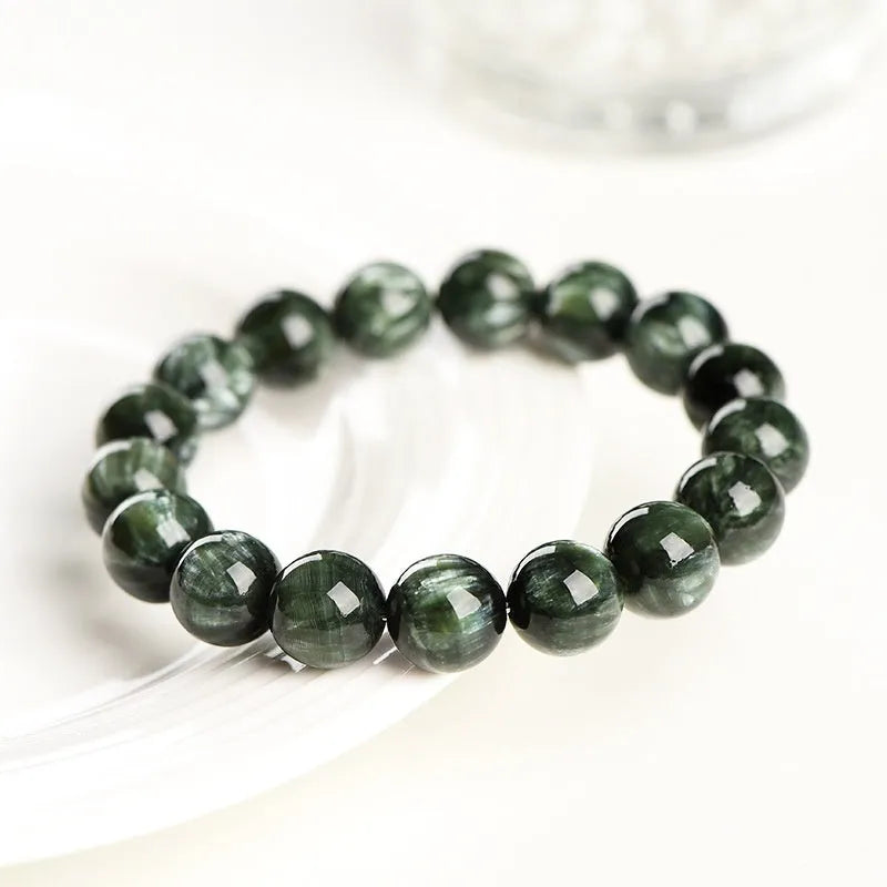 Green Dragon Crystal bracelet with round beads and ruyi design element.