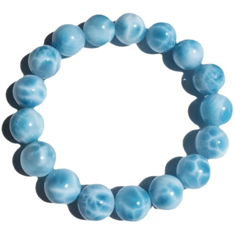 Blue Bodhi bracelet with sea-pattern crystal beads and pearl accents in Maillard style on wrist