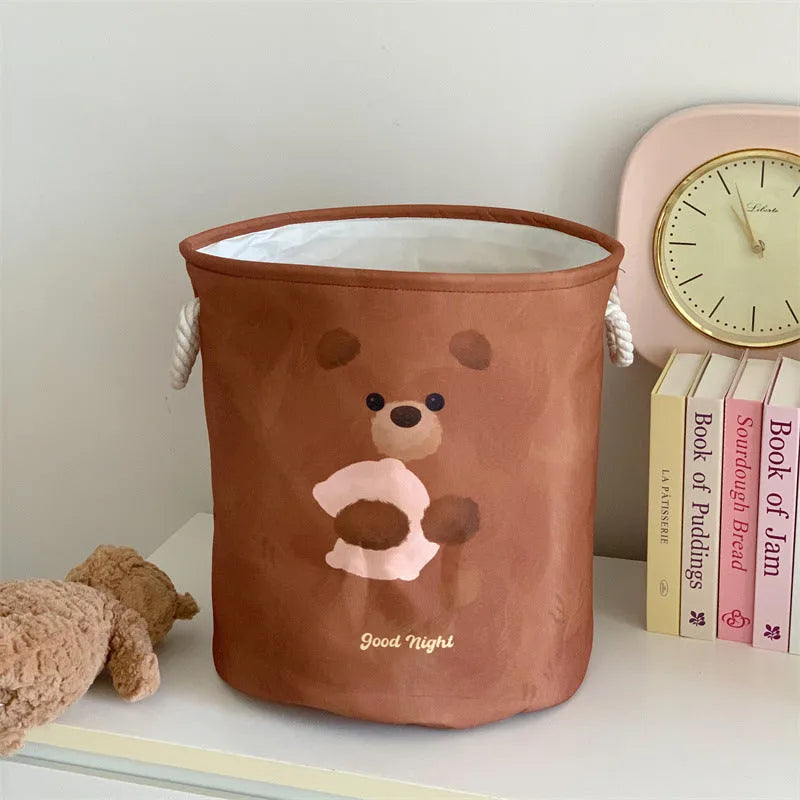 Foldable cotton laundry basket in a colourful design, shown unfolded for use.