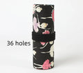 Ballet girl printed canvas roll-up pencil case unrolled to show multiple coloured pencils in slots