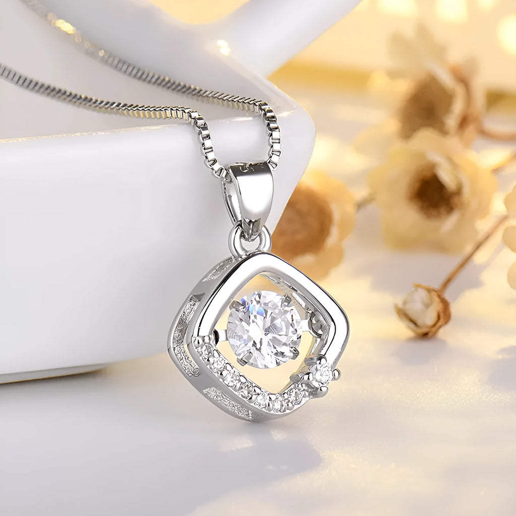 Heart-shaped pendant necklace with crown and bow design in rose gold or silver finish