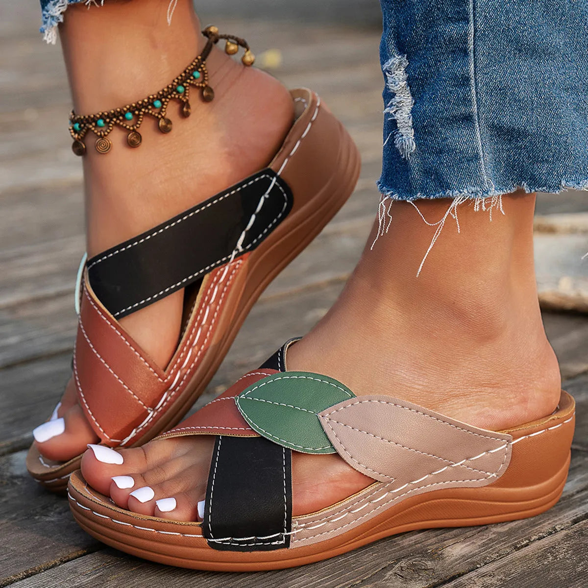 Women's black thick-soled slippers with cross-straps and a peep-toe