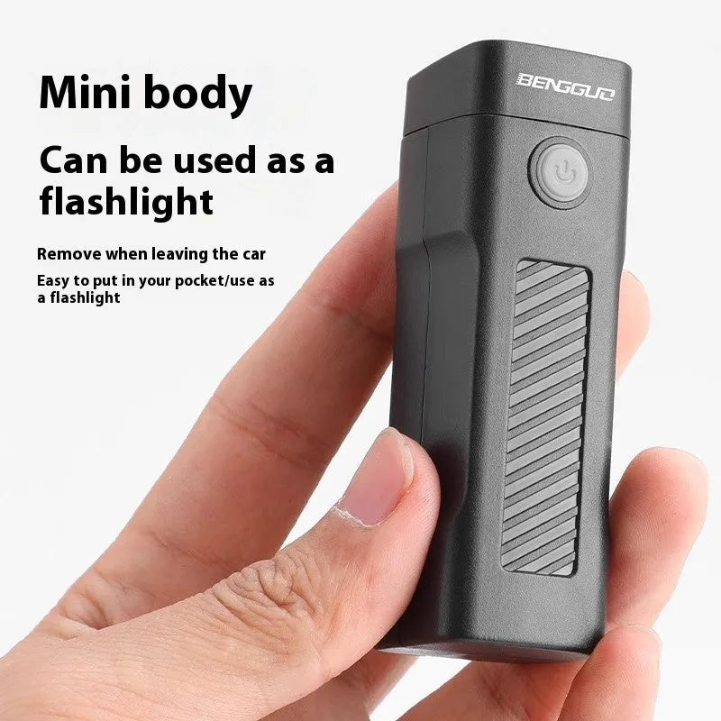 Black USB-rechargeable bicycle headlight with quick-release strap mount on handlebars.