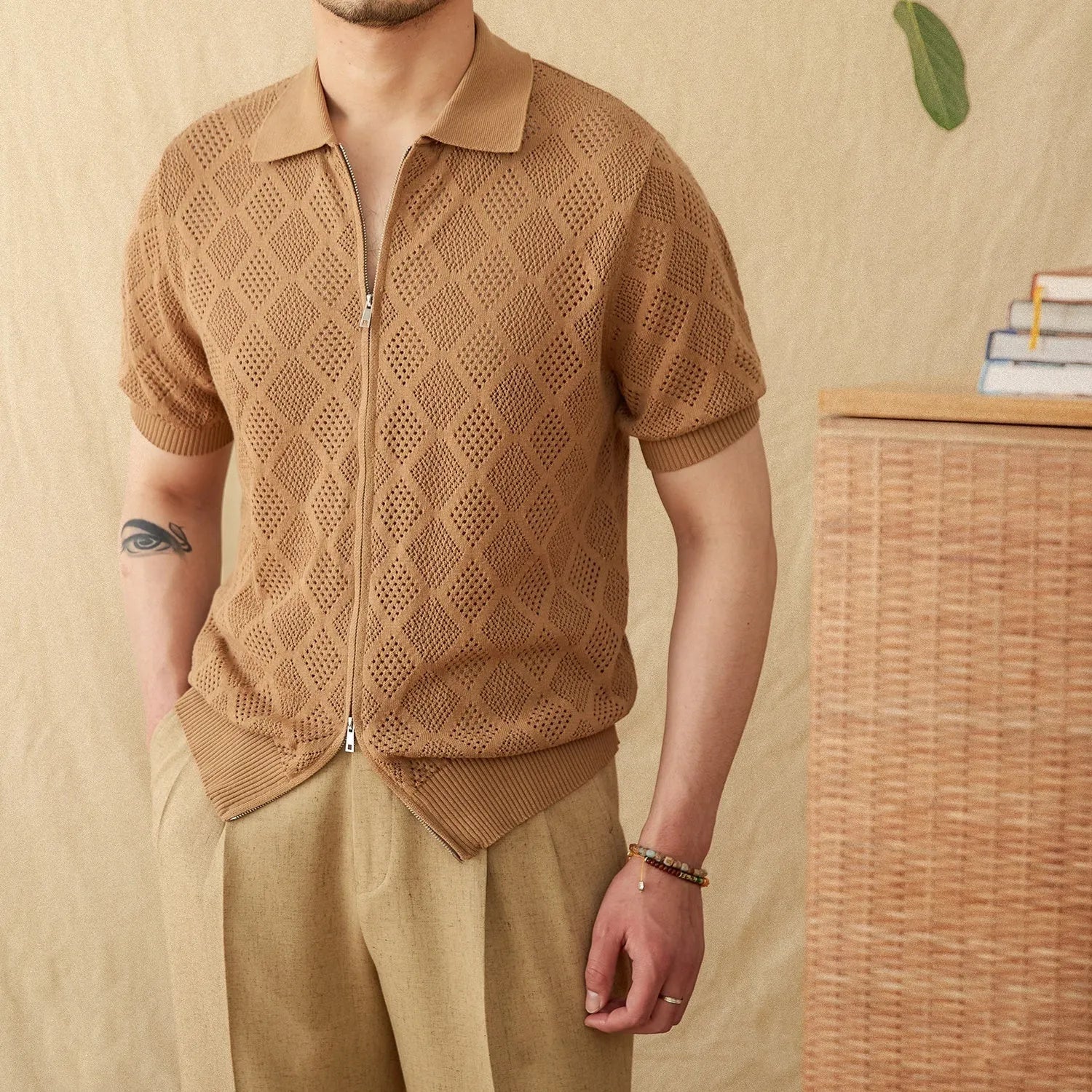Light brown cotton short sleeve cardigan with zip front and lapel collar laid flat