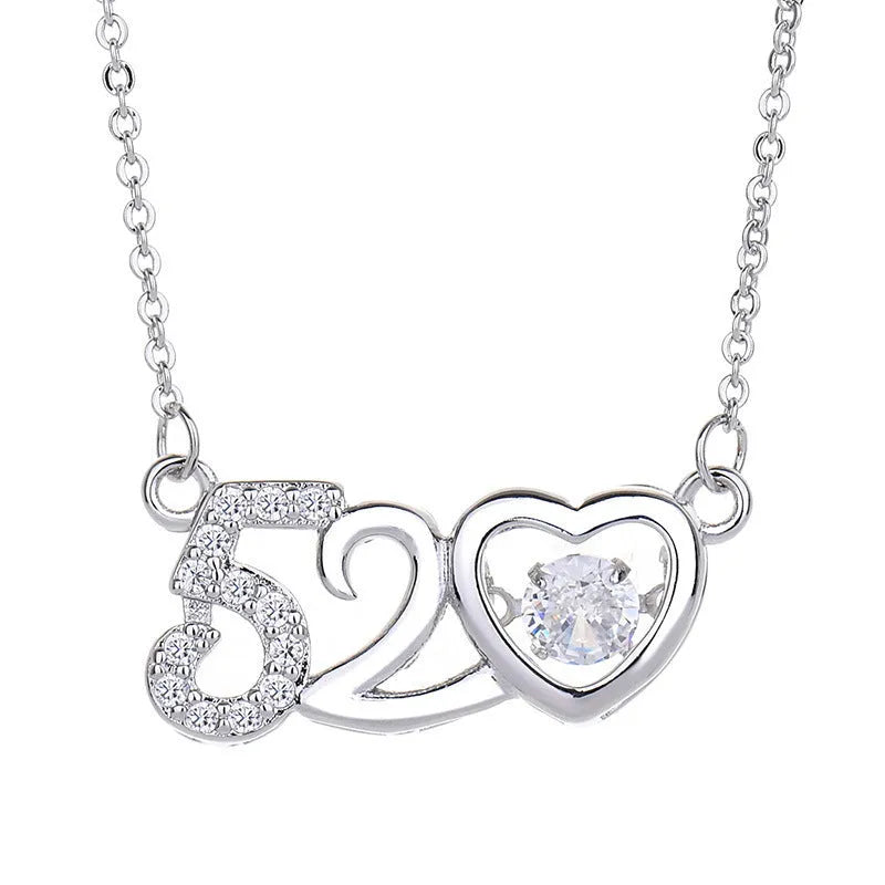 Heart-shaped pendant necklace with crown and bow design in rose gold or silver finish