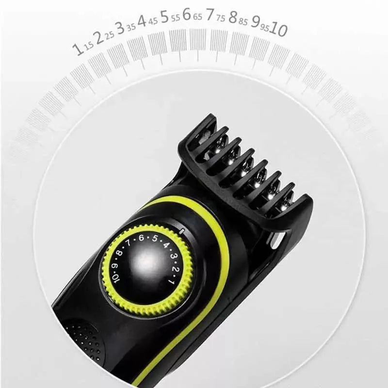 Black KM-696 USB rechargeable electric hair clipper set with stainless steel blades and accessories on a cloth