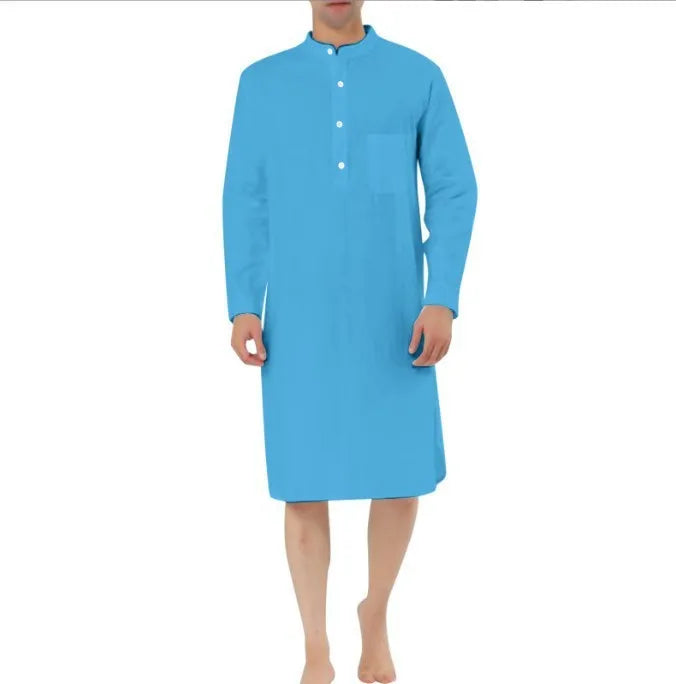 Man wearing a dark blue cotton robe shirt with button front and chest pocket