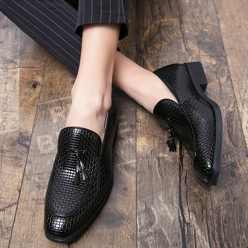 Men's black pointed toe slip on shoes with tassel detail on artificial PU upper