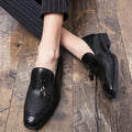 Men's black pointed toe slip on shoes with tassel detail on artificial PU upper