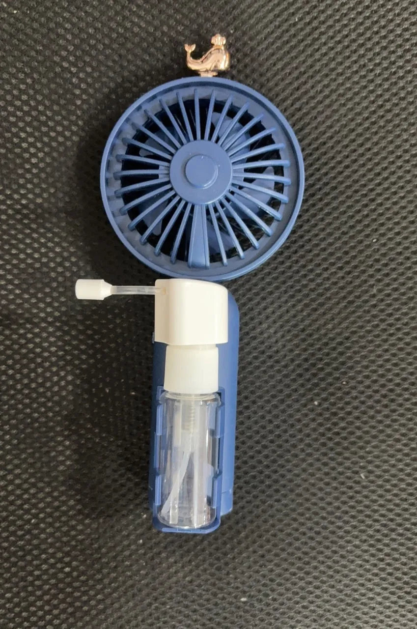 A handheld USB personal fan in one of five colours: apricot, blue, green, orange, or pink, showing its plastic nozzle and compact size.