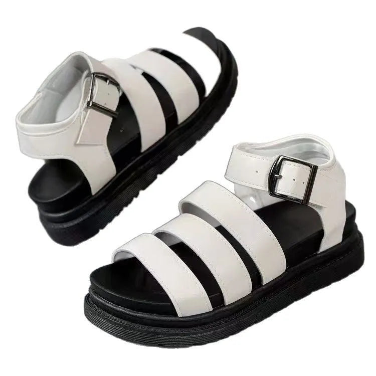 A pair of thick-soled casual sandals with an adjustable buckle strap over a black PU upper and rubber sole.