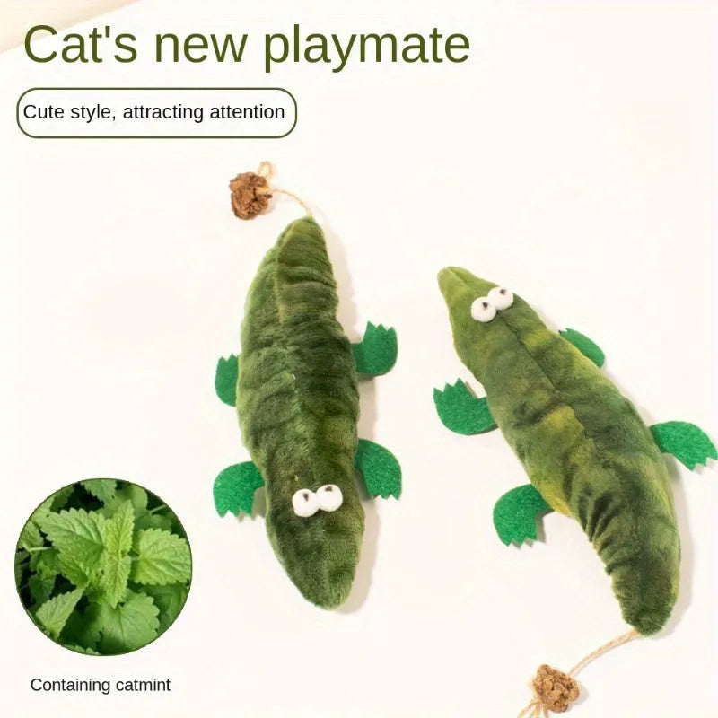 Green plush alligator catnip toy with peppermint scent on a white background.