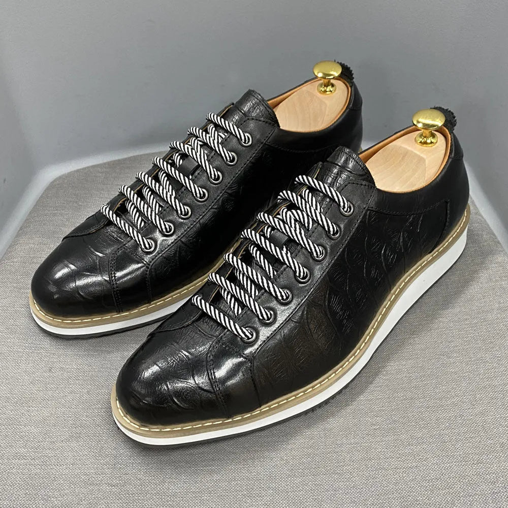 Men's low-top fashion shoes with an embossed pattern on the upper and front-tie laces.